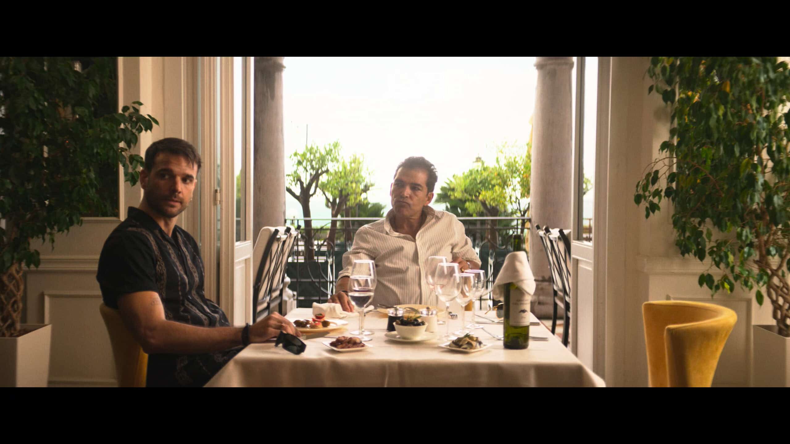 Alvaro and Jeremy having a business lunch, waiting for Alexander