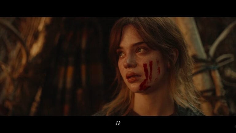 Natalie (Sophie Thatcher) with blood on her cheek