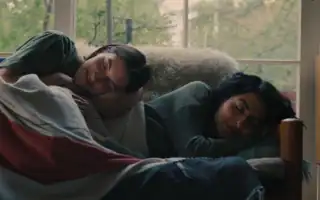 Lou (Susie Yankou) and Priya (Kausar Mohammed) napping after a night drinking and having fun