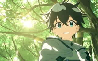 Kyle smiling in the forest