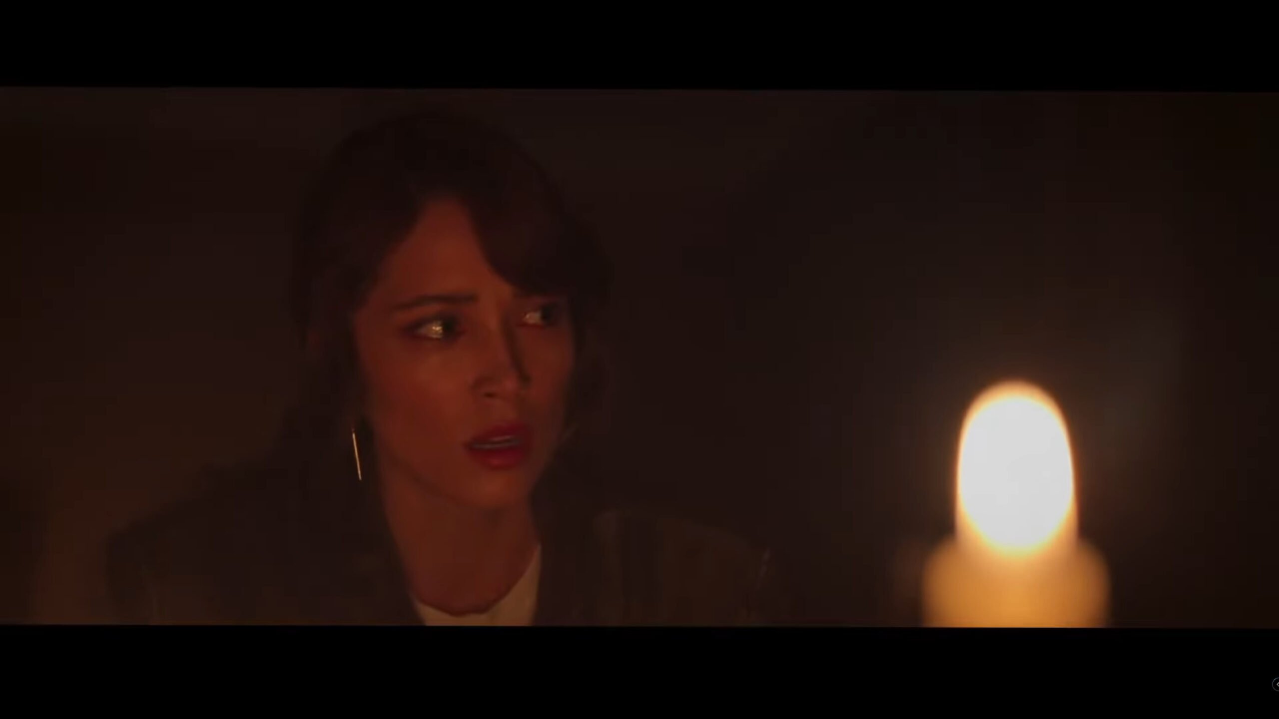 Brooke (Melanie Jarnson)  watching what is happening as Alexander uses the witchboard – Witchboard