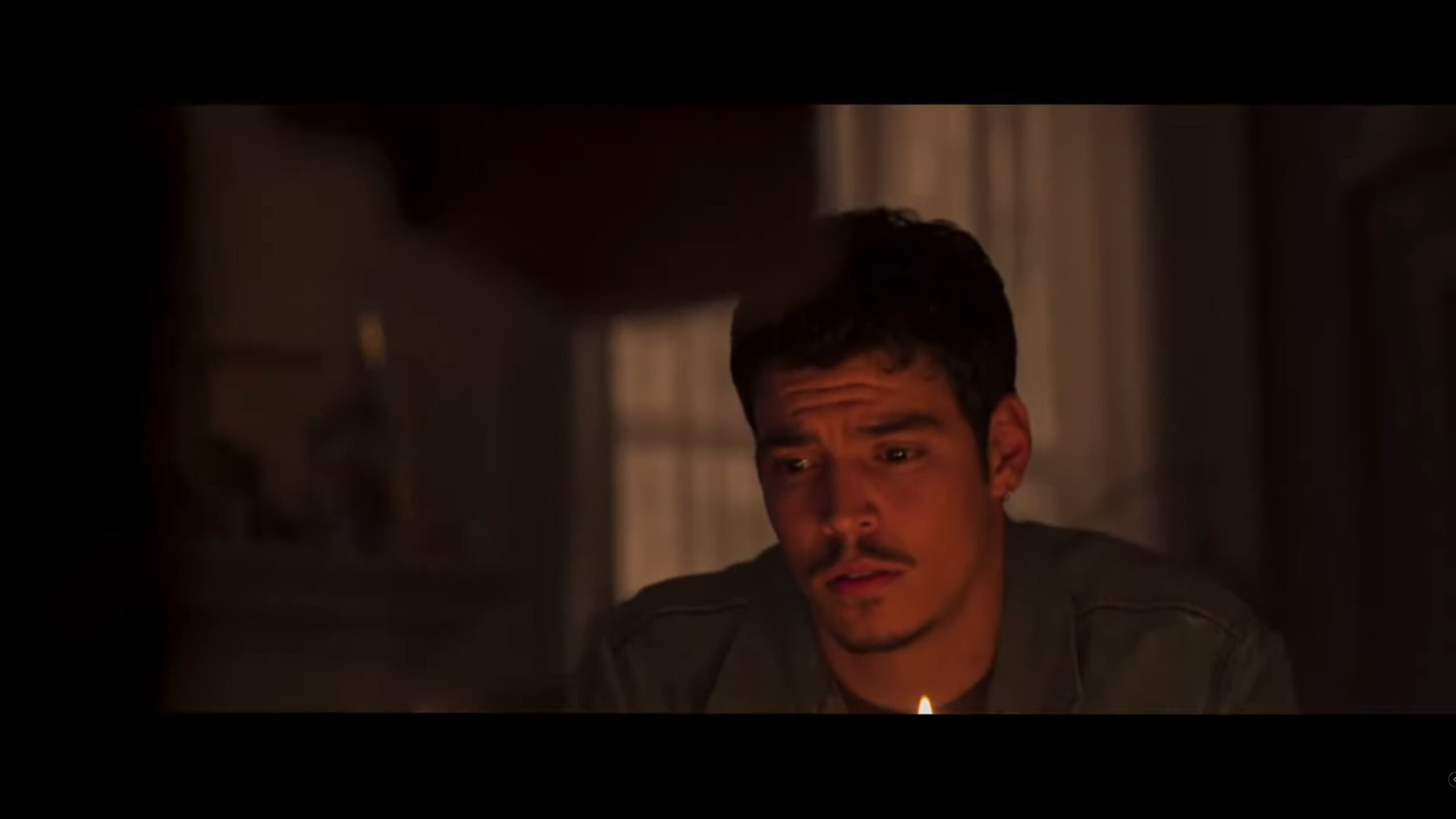Christian (Aaron Dominguez) watching the witchboard be used professionally – Witchboard