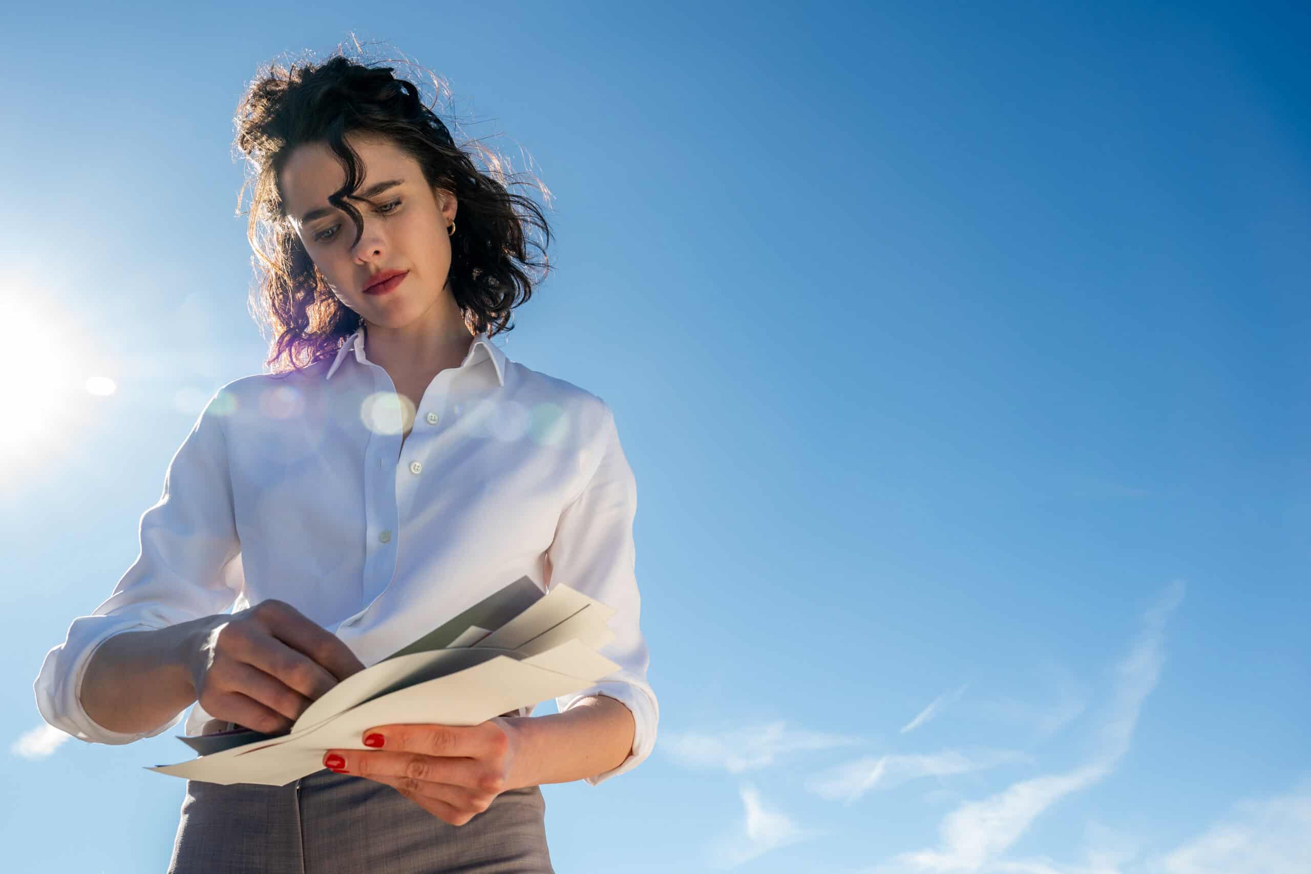 Honey (Margaret Qualley) looking through mail – Honey Don’t