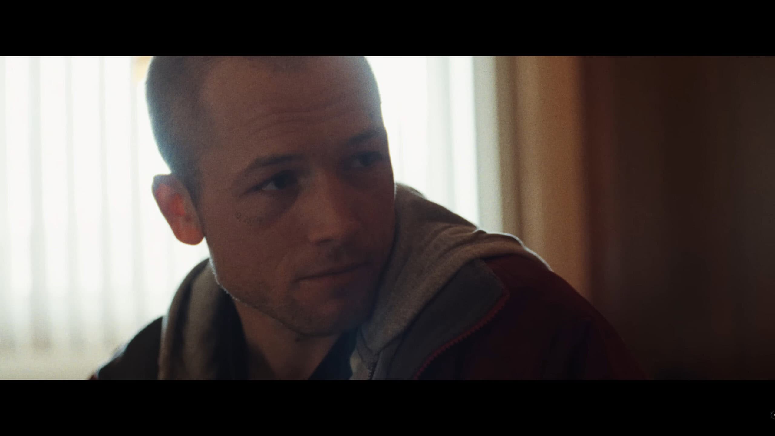 Nathan (Taron Egerton) talking to Polly