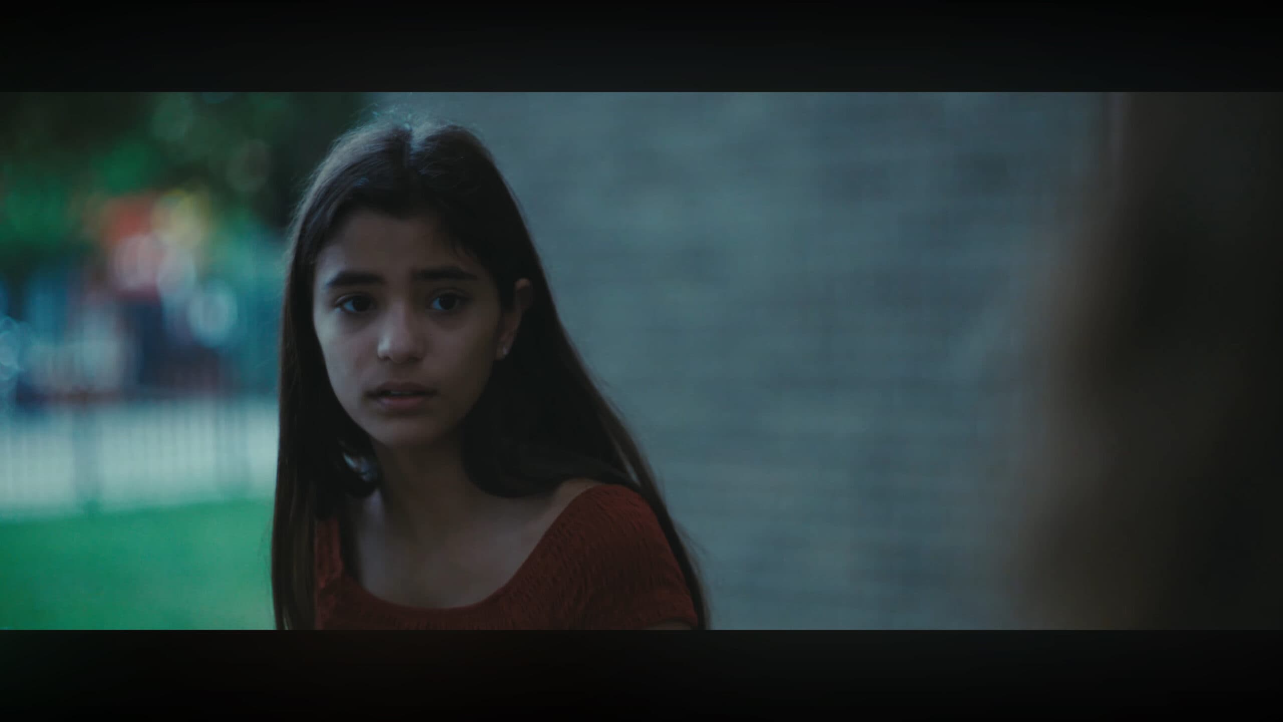 Elaine (Natahlia Lares) talking to someone outside her building – Brownsville Bred