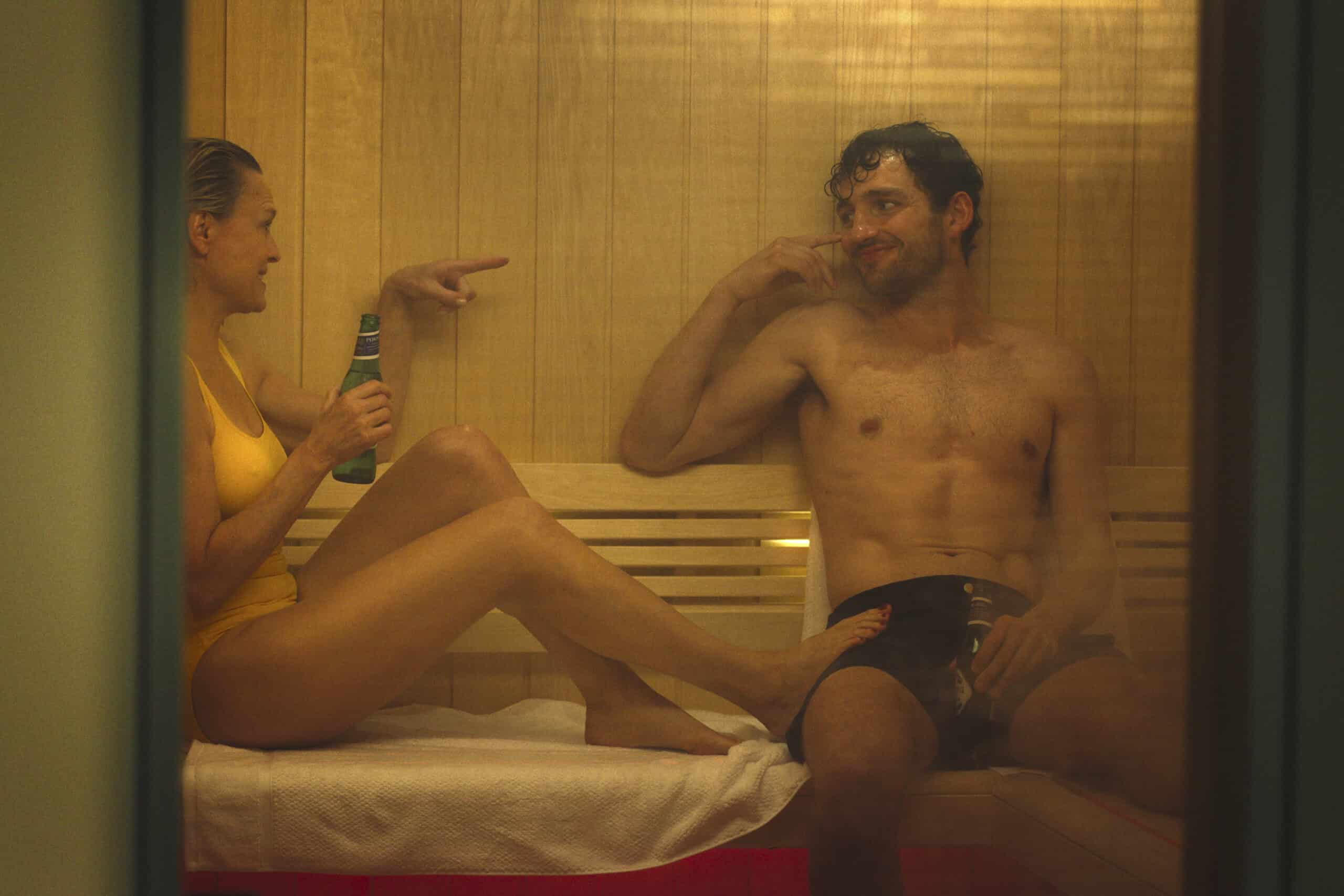 Laura (Robin Wright) and Daniel (Laurie Davidson) in a sauna together - The Girlfriend Season 1