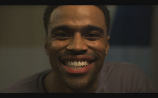 Ozzie smiling in the mirror - Reasonable Doubt Season 3 Episode 2