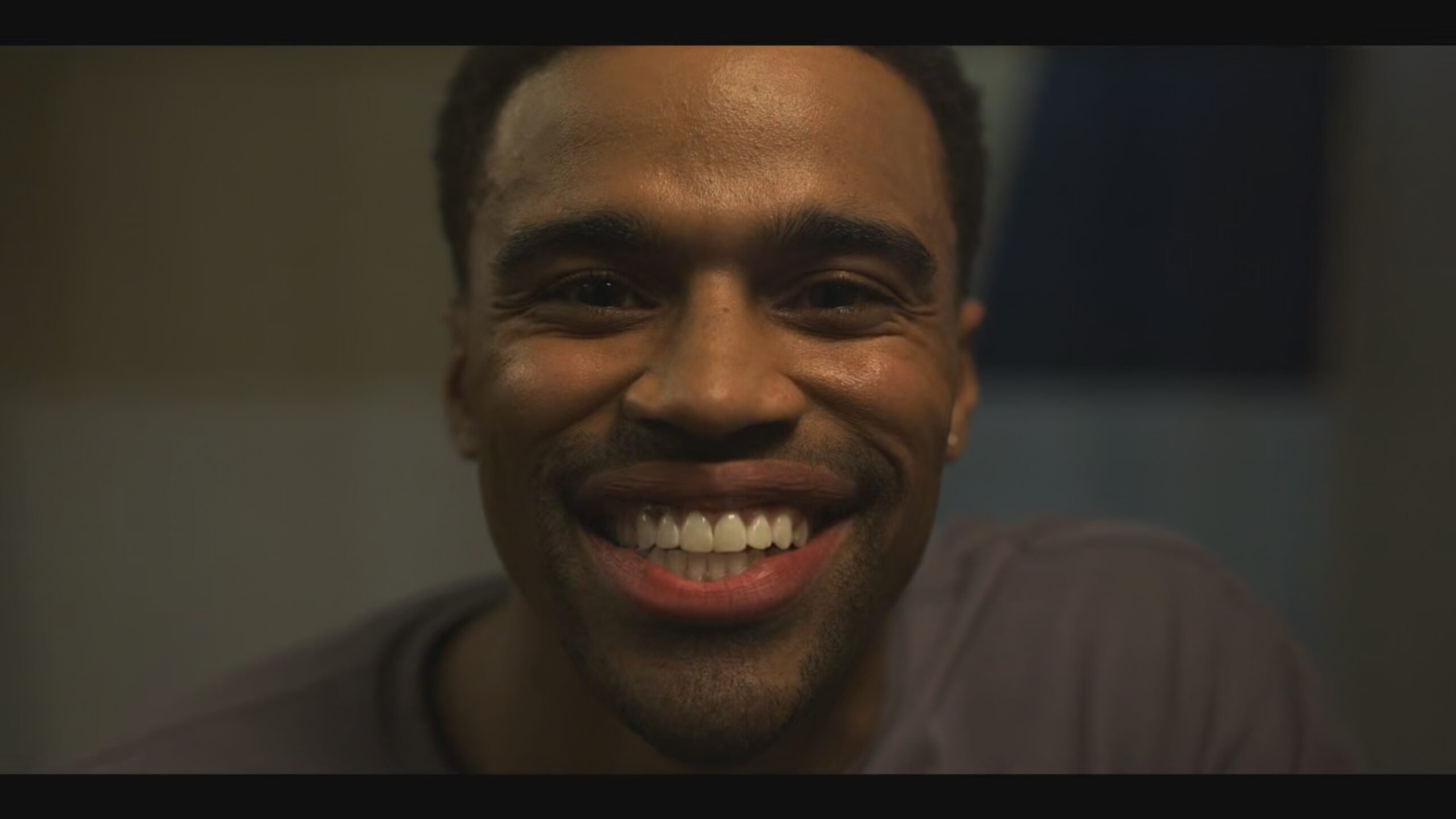 Ozzie smiling in the mirror - Reasonable Doubt Season 3 Episode 2