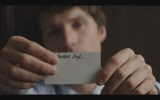 Helen's Card which reads "We watch and we are always there" - Talamasca – The Secret Order Season 1 Episode 1