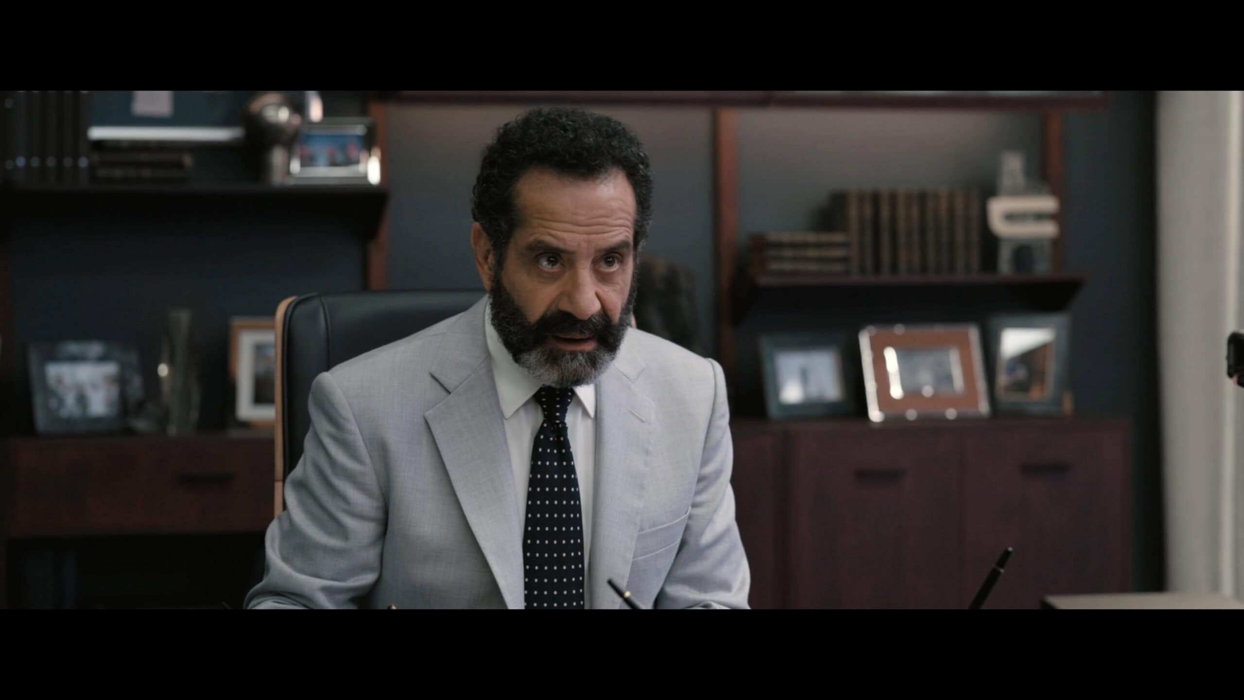 Lozini (Tony Shalhoub) learning Parker is in New York – Play Dirty