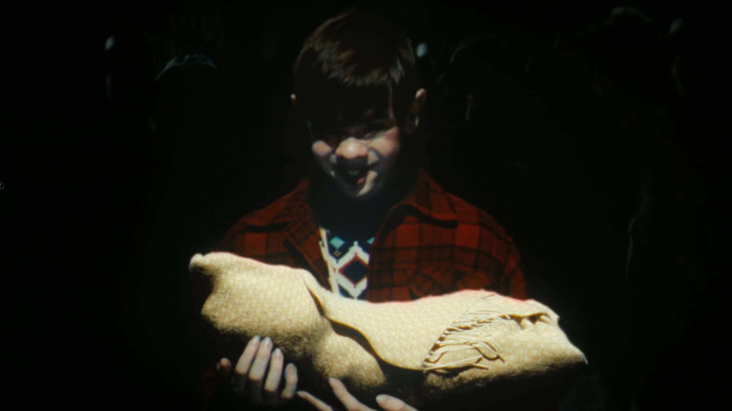 Matty holding a demon baby