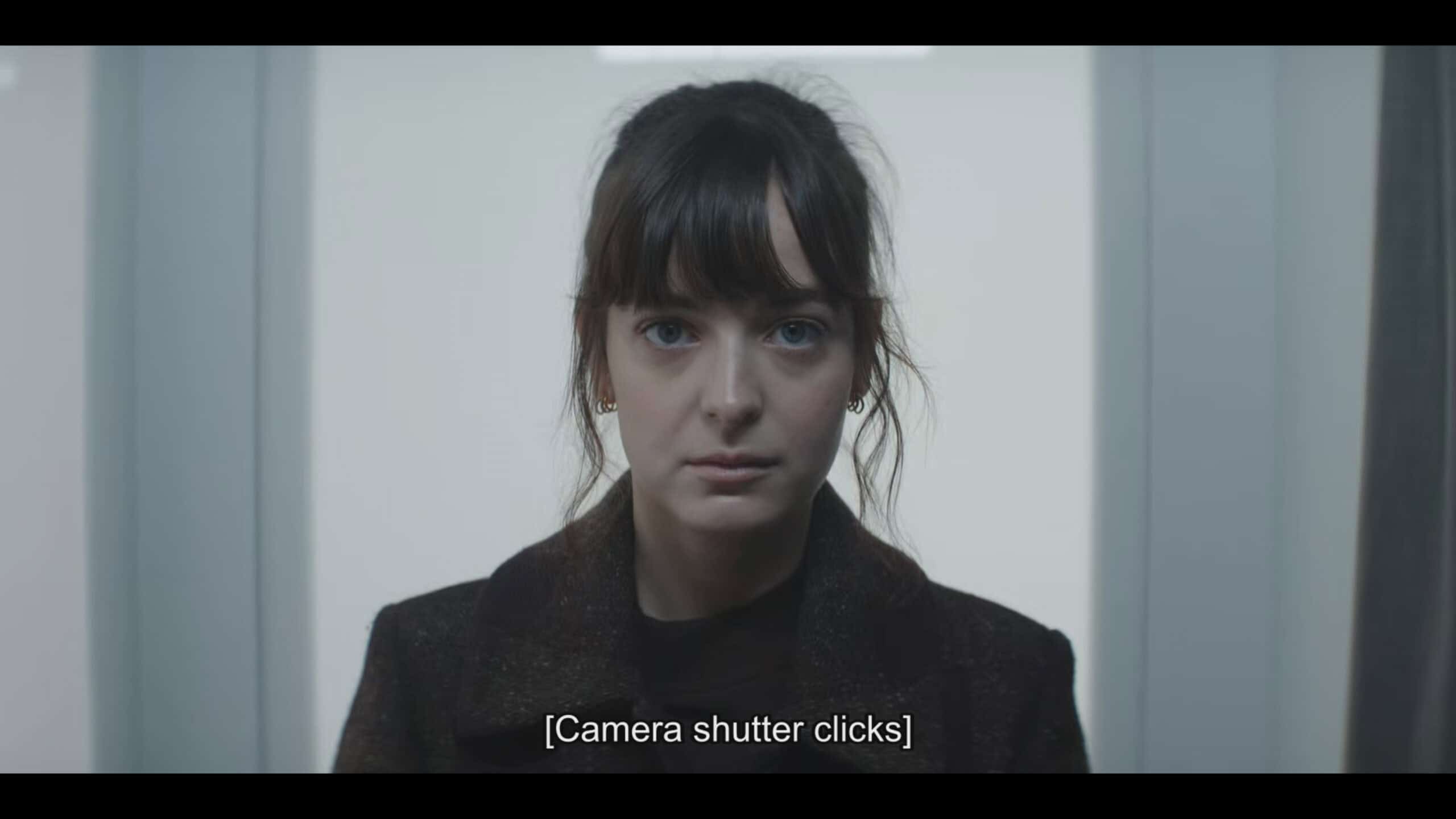 Doris taking a passport photo - Talamasca The Secret Order Season 1 Episode 5