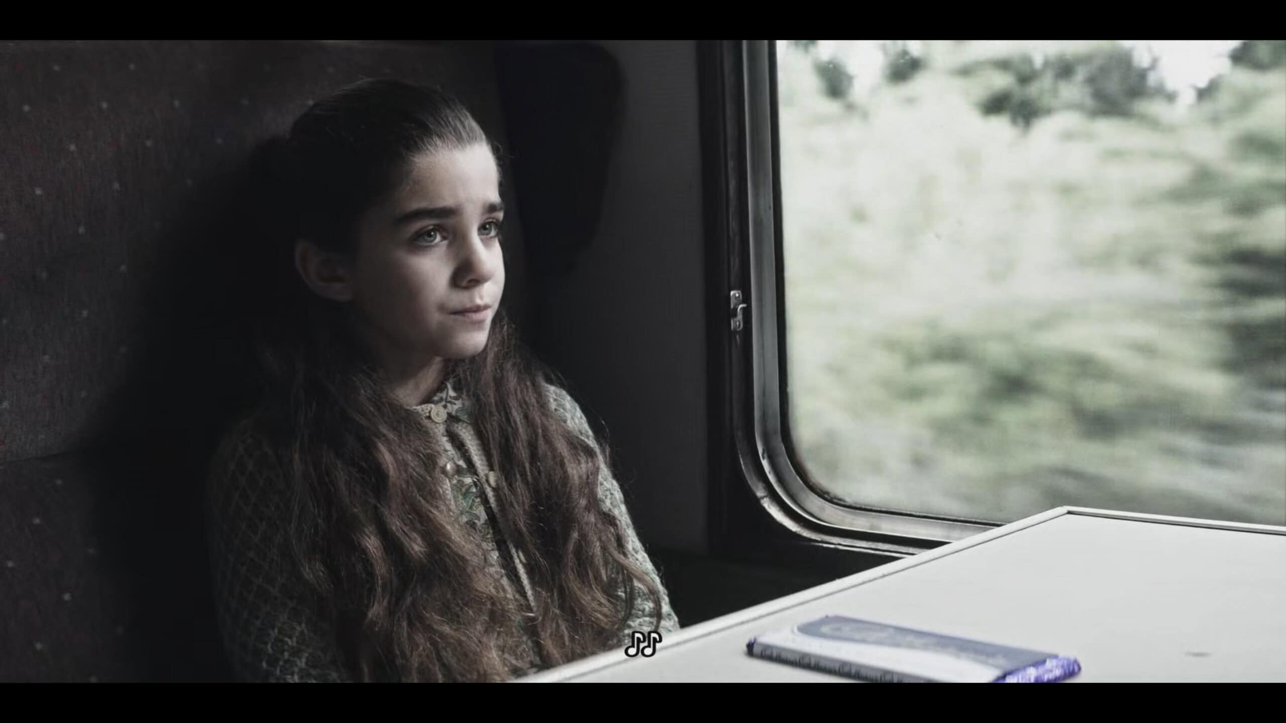 Emma (Rosie Mellor) on a train - Talamasca The Secret Order Season 1 Episode 5