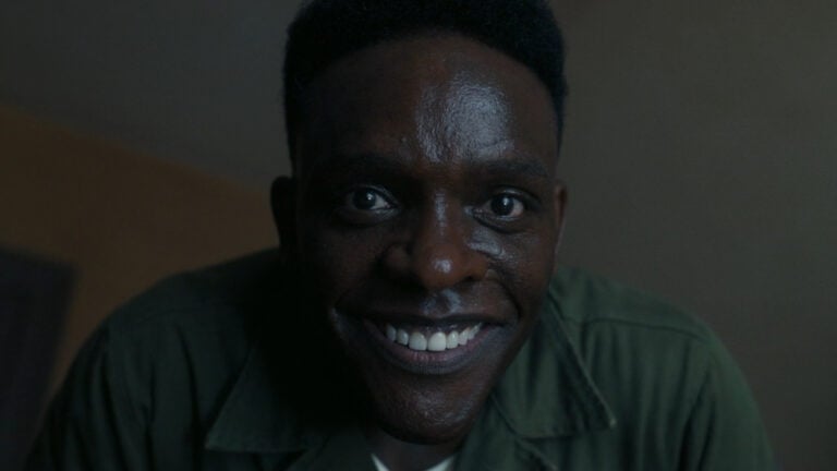 Hallorann smiling in a creepy way at Taniel - IT – Welcome To Derry Season 1 Episode 4